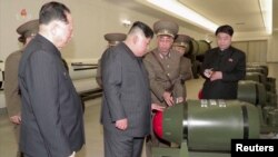 FILE - A screen grab shows North Korean leader Kim Jong Un inspecting nuclear warheads at an undisclosed location in this undated still image used in a video released March 28, 2023. (KRT/Handout via Reuters)