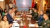 Indian Defence Minister Rajnath Singh, seated third left, attends a meeting with his Chinese counterpart Li Shangfu, third right, during the Shanghai Cooperation Organization Defence Minister's Meeting in New Delhi, April 27, 2023. 