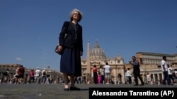 Sister Nathalie Becquart, the first female undersecretary in the Vatican's Synod of Bishops, poses for a photo in front of St. Peter's Square, Monday, May 29, 2023. (AP Photo/Alessandra Tarantino)
