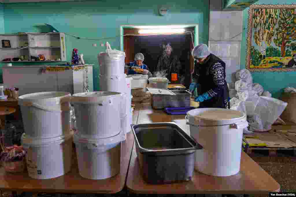 In this humanitarian kitchen, volunteers serve some 6,000 meals every day for those who can’t leave Kupiansk, Feb. 17, 2023.