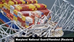 FILE - Aerial view of the Dali cargo vessel which crashed into the Francis Scott Key Bridge, causing it to collapse in Baltimore, Maryland, March 26, 2024.