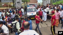 An ambulance leaves the Zamra International Convention Center after an explosive device blew up during a prayer gathering of Jehovah's Witness faithful in Kalamassery, in India's southern Kerala state, Oct.29, 2023. 