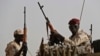 Sudanese soldiers from the Rapid Support Forces unit, led by Gen. Mohammed Hamdan Dagalo, the deputy head of the military council, secure the area where Dagalo attends a military-backed tribe's rally, in the East Nile province, Sudan. (Hussein Malla/AP Photo)
