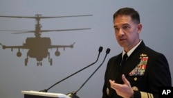 FILE - U.S. Navy Vice Adm. Brad Cooper, who heads the Navy's Bahrain-based 5th Fleet, speaks in Abu Dhabi, United Arab Emirates, Feb. 21, 2023. Cooper says Yemen’s Houthi rebels are showing "no signs" of ending "their irresponsible behavior" in the Red Sea.