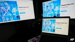 FILE - Screens display the sign-in page of the social media platform X — formerly known as Twitter — July 24, 2023, in Belgrade, Serbia. Rights advocates are urging social media platforms to do more to prevent Chinese authorities from obtaining the personal information of users. 