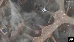 This image released by Maxar Technologies shows an overview of a destroyed SU 27 fighter aircraft at Belbek air base, near Sevastopol, in Crimea, May 16, 2024.