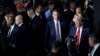 FILE - Republican presidential candidate former President Donald Trump, right, surrounded by members of the Secret Service, is seen arriving to attend the final night of the Republican National Convention in Milwaukee, Wisconsin, July 18, 2024.