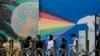 FILE - Visitors to the U.S. consular service line up outside the U.S. embassy in Beijing, Aug. 1, 2022. The Chinese government has protested to the United States over the treatment of Chinese arriving to study in America.