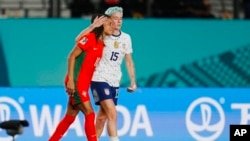 United States' Megan Rapinoe hugs Portugal's Jessica Silva, left, after the Women's World Cup Group E soccer match between Portugal and the United States at Eden Park in Auckland, New Zealand, Aug. 1, 2023.