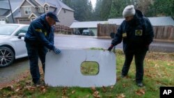 This photo released by the National Transportation Safety Board shows the door plug from Alaska Airlines Flight 1282, in Portland, Oregon, Jan. 8, 2024.