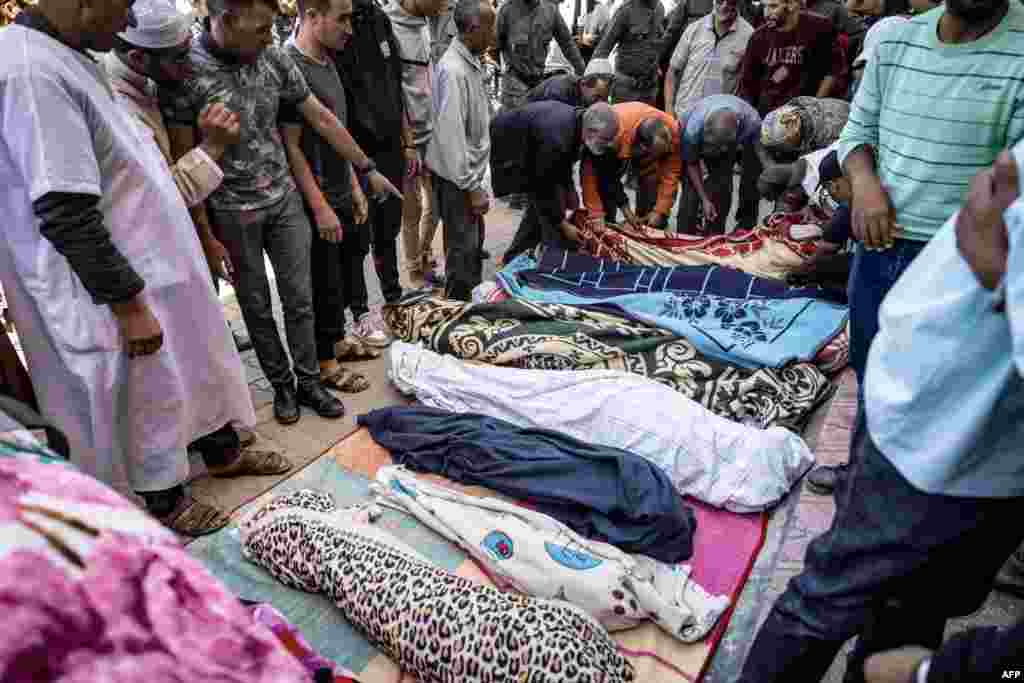 Relatives mourn in front of the bodies of the victims killed in an earthquake in Moulay Brahim, Al Haouz province, Morocco, on Sept. 9, 2023.