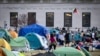 A student protester flies a kite inside the protest encampment on the Columbia University campus, April 29, 2024, in New York. 