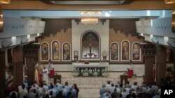 Chaldean Christians attend a service in the Mar Youssef Cathedral in Irbil, Iraq, on July 30, 2023.