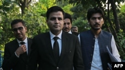 Naeem Haider Panjutha, center, spokesperson for former Pakistan's Prime Minister Imran Khan on legal affairs, arrives for a media briefing in Islamabad on Aug. 7, 2023, after meeting with Khan in Attock Jail.