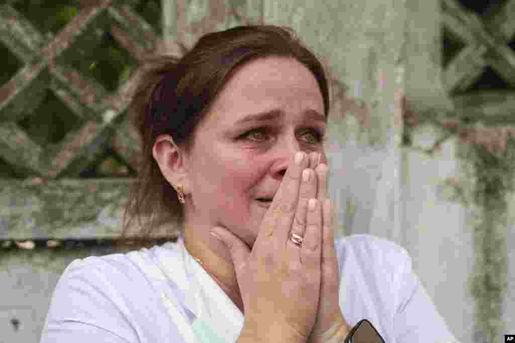 A woman reacts near the site of Okhmatdyt children’s hospital hit by Russian missiles, in Kyiv, Ukraine. A major Russian missile attack across Ukraine killed at least 31 people and injured more than 50, officials said.