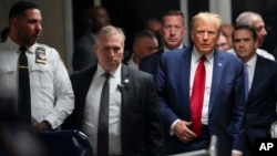 FILE - Donald Trump leaves Manhattan criminal court, Feb. 15, 2024. The president-elect has sought to have a civil judgment against him for fraud set aside.