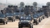 FILE - Military personnel participates in a parade on Armed Forces Day in Naypyitaw, Myanmar, March 27, 2021. 