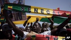 People shout slogans during a protest against the possibility of President Macky Sall to run for a third term in the presidential elections next year in Dakar, Senegal, May 12, 2023.