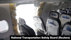 FILE - The fuselage plug area of Alaska Airlines Flight 1282 Boeing 737-9 MAX, which was forced to land with a gap in the fuselage, in Portland, Oregon, Jan. 7, 2024. The Senate has passed a $105 billion bill designed to improve air safety. (NTSB/handout via Reuters)