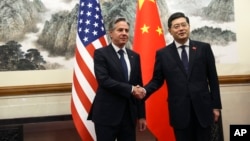 U.S. Secretary of State Antony Blinken shakes hands with Chinese Foreign Minister Qin Gang at the Diaoyutai State Guesthouse in Beijing, China, June 18, 2023. 