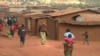 FILE - Refugees from various nationalities walk through Dzaleka refugee camp in Dowa District Central region of Malawi, on June 20, 2018.