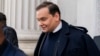 U.S. Rep. George Santos leaves the Capitol after being expelled from the House of Representatives, Dec. 1, 2023, in Washington. 
