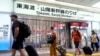 Slow tropical storm dumps heavy rain around Tokyo after causing floods