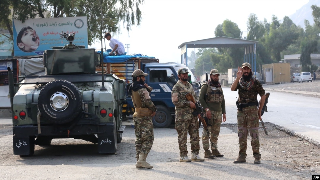 FILE - Taliban security personnel stand guard at the Pakistan-Afghanistan border in Torkham, Afghanistan, on Sept. 15, 2023. 