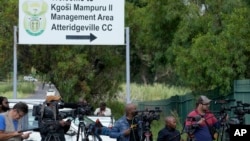 Members of the media stand outside the main gate of the Atteridgeville Prison in Pretoria, South Africa, Jan. 5, 2024.