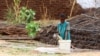 FILE - A displaced Sudanese child pours water at Zamzam camp, in North Darfur, Sudan, Aug. 1, 2024.