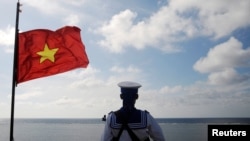 FILE - A Vietnamese naval soldier stands guard at Thuyen Chai island in the Spratly archipelago in the South China Sea on Jan. 17, 2013. 