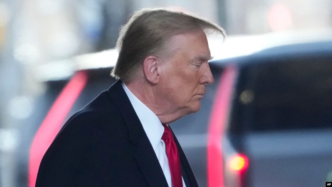 Former President Donald Trump leaves his apartment building in New York, Jan. 17, 2024, planning to attend the penalty phase of a civil defamation trial over a columnist's claims he sexually attacked her in a department store dressing room in the 1990s.