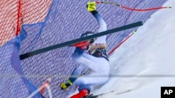 FILE - Norway's Aleksander Aamodt Kilde falls during an alpine ski, men's World Cup downhill race, in Wengen, Switzerland, Jan. 13, 2024.