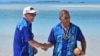 Australia's Prime Minister Anthony Albanese, left, and Tuvalu's Prime Minister Kausea shake hands on One Foot Island after attending the Leaders' Retreat during the Pacific Islands Forum in Aitutaki, Cook Islands, Nov. 9, 2023.