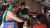 A health worker administers polio vaccine drops to a child during a vaccination campaign in Lahore, Pakistan, October 24, 2022. 