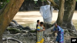 Devotees of the Osun River goddess pray in Osogbo, Nigeria, on May 29, 2022.