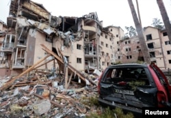 A view shows a residential building destroyed by recent shelling, as Russia's invasion of Ukraine continues, in the city of Irpin in the Kyiv region, March 2, 2022.