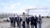 Taiwan's Foreign Minister Joseph Wu, fourth from right, stands with an American delegation including former Chairman of the Joint Chiefs Adm. Mike Mullen, third from right, as they arrive at Taipei Songshan Airport in Taipei, Taiwan, Tuesday, March 1, 2022.
