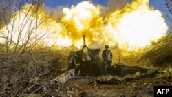 A Ukrainian soldier of an artillery unit fires towards Russian positions outside Bakhmut, Nov. 8, 2022, amid the Russian invasion of Ukraine.