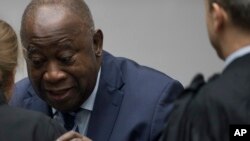Laurent Gbagbo et ses avocats à la CPI, à La Haye aux Pays-Bas le 15 janvier 2019.