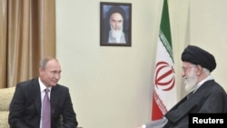 FILE - Russia's President Vladimir Putin, left, meets with Iran's Supreme Leader Ayatollah Ali Khamenei in Tehran, Iran, Nov. 23, 2015. 