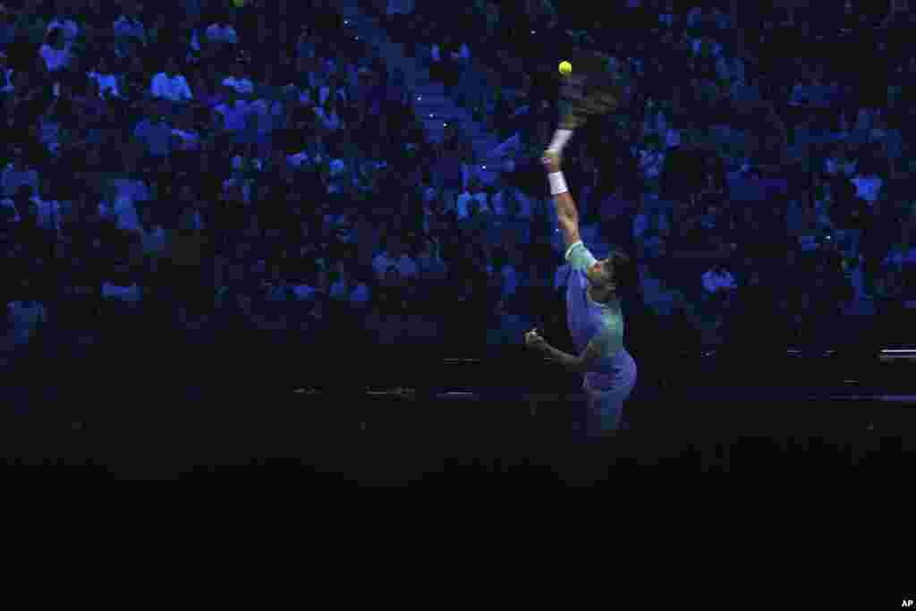 Spain's Carlos Alcaraz returns the ball to Norway's Casper Ruud during their singles tennis match of the ATP World Tour Finals at the Inalpi Arena, in Turin, Italy.