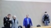 Russian opposition leader Alexei Navalny (left) during a court hearing at the IK-2 corrective penal colony in the town of Pokrov in Vladimir Region, Russia March 22, 2022. 