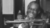 Jazz trumpeter Louis Armstrong shown in the upstairs den of his Corona, New York home, June 23, 1971. 