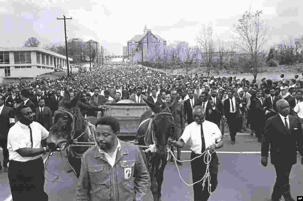 This April 1968 photo released by the MLK Jr. National Historic Site shows the body of Martin Luther King Jr. being carried to Morehouse College in Atlanta, Georgia. (AP/MLK Jr. National Historic Site,Courtesy of Bob Adelman)