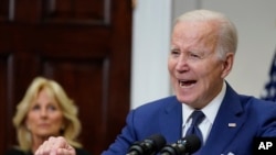 President Joe Biden speaks about the mass shooting at Robb Elementary School in Uvalde, Texas, from the White House, in Washington, Tuesday, May 24, 2022, as first lady Jill Biden listens.
