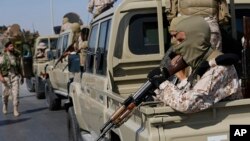 Forces loyal to Abdul Hamid Dbeibah, one of Libya’s two rival prime ministers, secure the streets of the capital, Tripoli, May, 17, 2022. 