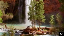FILE - Hikers enjoy the pools below Havasu Falls, one of three main waterfalls in Havasupai Canyon in Supai, Arizona, a pocket of the Grand Canyon, on April 8, 2006.