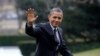  President Barack Obama waves following his arrival on Marine One helicopter from the House Democratic Issues Conference in Lansdowne, Virginia, as he walks across the South Lawn of the White House in Washington, February 7, 2013.