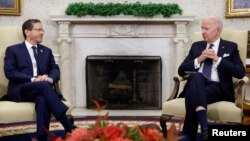 U.S. President Joe Biden meets with Israeli President Isaac Herzog in the Oval Office at the White House in Washington, Oct. 26, 2022. 